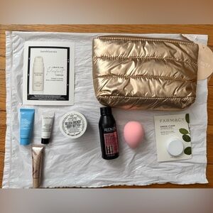 Gold Cosmetic Bag with Skincare and Beauty Products